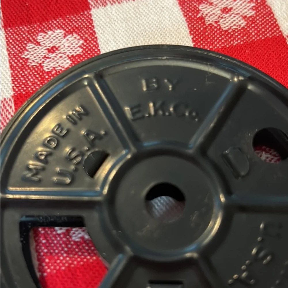 Vintage tin movie reel container with lock
